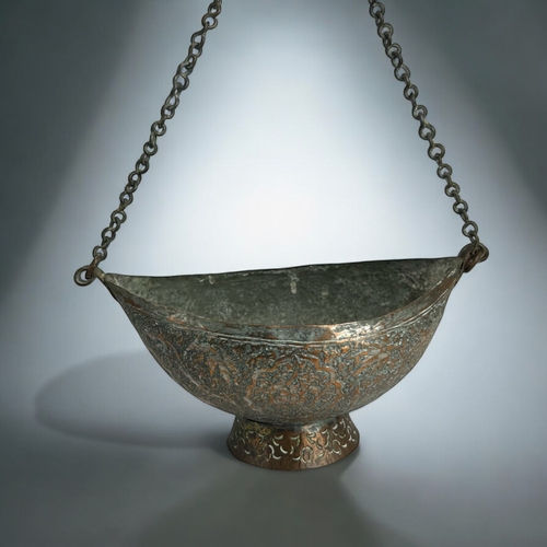 120A - A persian tinned copper 'Beggar's bowl' (Kashkul).18th-19th century.Engraved with stylised foliate d... 