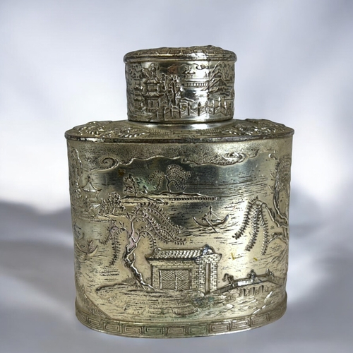 232 - A Chinese silvered copper Tea caddy.Early 20th century.Relief decorated 'Willow' landscape. 12 x 10c... 