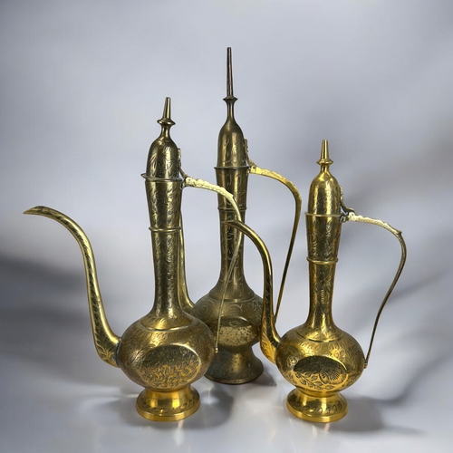 385 - Three vintage Indo-Persian brass Surahi Aftaba water ewers.Tallest - 40cm