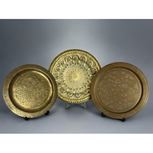 386 - Three vintage Islamic / Moroccan brass trays.Largest - 36cm diameter.