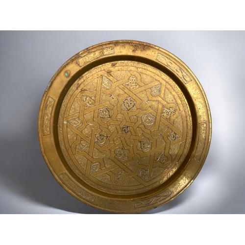 386 - Three vintage Islamic / Moroccan brass trays.Largest - 36cm diameter.