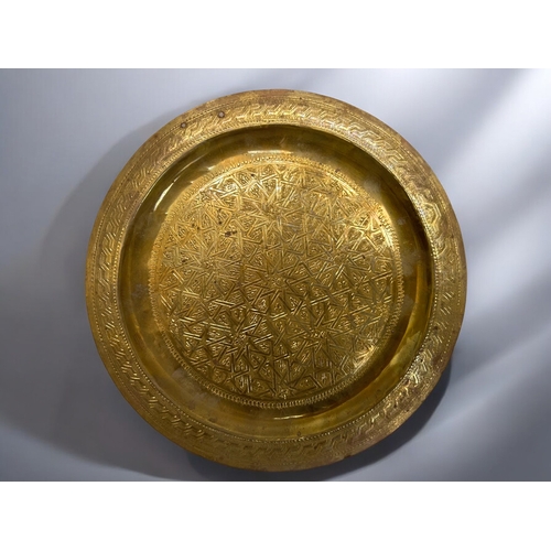 386 - Three vintage Islamic / Moroccan brass trays.Largest - 36cm diameter.