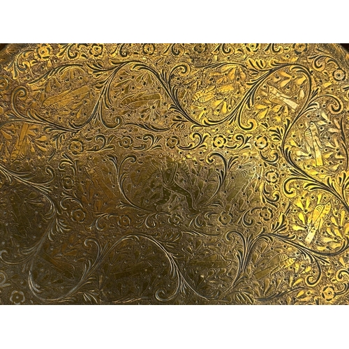 387 - Antique etched brass tray.Indian, 19th / 20th century.30 x 22cm