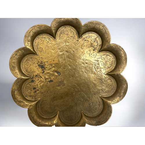 388 - Two antique Indian brass trays.Engraved designs, with scalloped edges. Diameter - 31cm