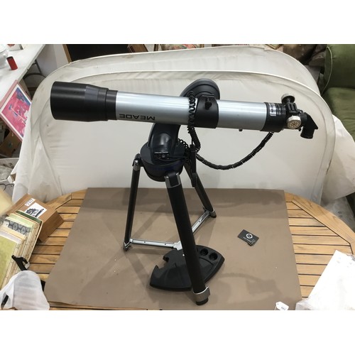 346 - Astronomical telescope on tripod legs and battery operated adjust