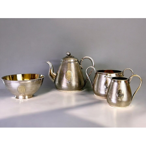 223 - A fine quality silver plate tea set.William Gough, Birmingham (C1850).Overall engine turned basket w... 