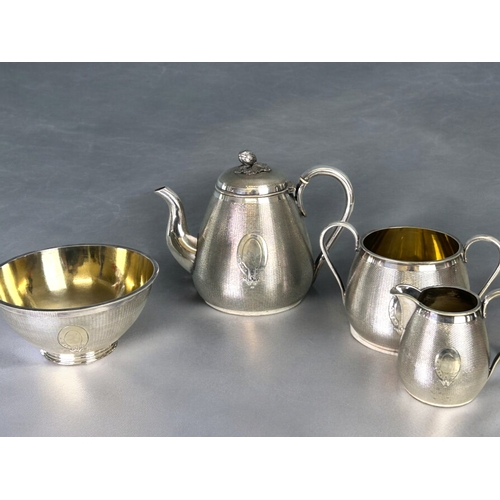 223 - A fine quality silver plate tea set.William Gough, Birmingham (C1850).Overall engine turned basket w... 