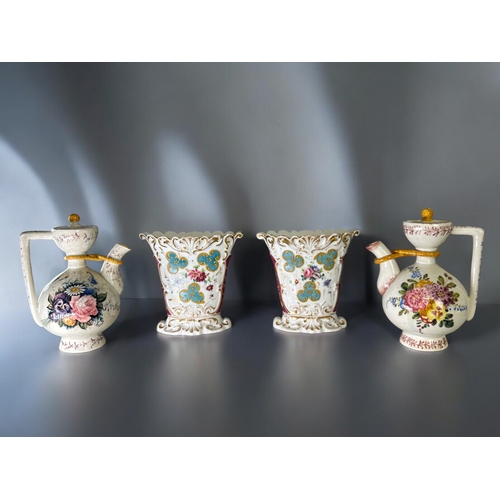 291 - A pair of 19th century Paris porcelain vases.Hand painted sprays of flowers with moulded, gilded des... 