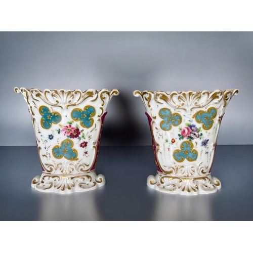 291 - A pair of 19th century Paris porcelain vases.Hand painted sprays of flowers with moulded, gilded des... 