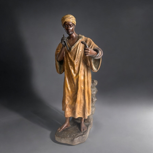 297 - A large Friedrich Goldscheider (Austrian, 1845 - 1897) 'Arab snake charmer' figure. Designed by G. G... 