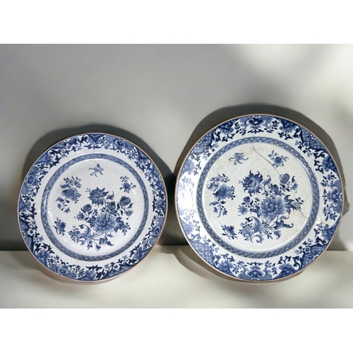 401 - Two large Chinese export porcelain blue & white chargers.Qing dynasty, 18th century.Painted blos... 