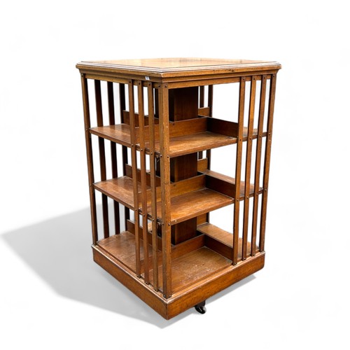 414 - A large Edwardian three tier revolving bookcase.H 115cmSq 66cm