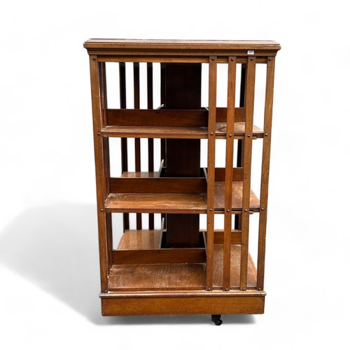 414 - A large Edwardian three tier revolving bookcase.H 115cmSq 66cm