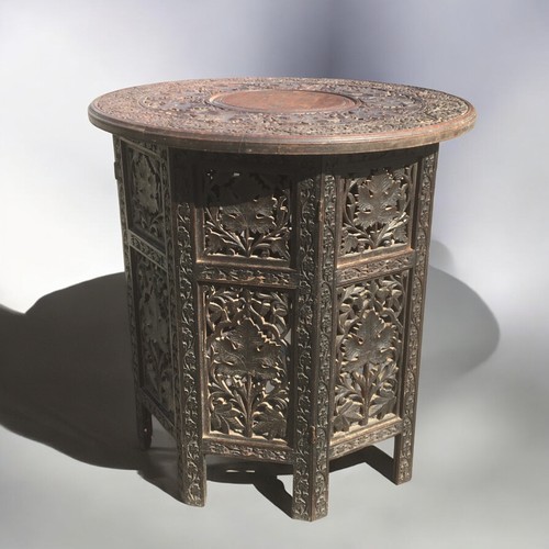 358 - Early 20th Century Indo Persian Carved Wood Collapsible Table with Brass Inlay. Heavily carved Folia... 