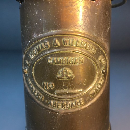 17 - Welsh Miners Lamp by E Thomas and Williams Ltd Cambrian No 5694, Brass Spitfire and a Bronze Bell.