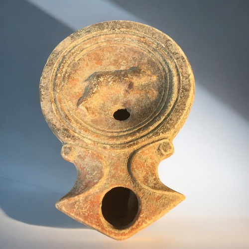 88 - 1st-2nd C Roman Disc Form oil lamp featuring Running Bear logo.9cm Length x 6.5cm Dia.