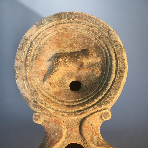 88 - 1st-2nd C Roman Disc Form oil lamp featuring Running Bear logo.9cm Length x 6.5cm Dia.