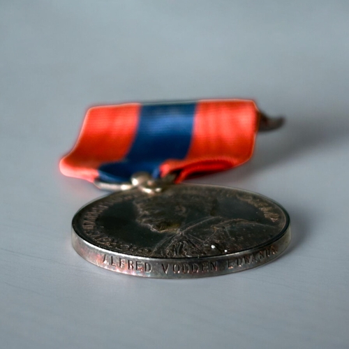 428 - A boxed Imperial service medal, George V.Awarded to Alfred Vodden Edwards.With ribbon & case.... 