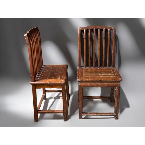 408 - A PAIR OF CHINESE CARVED PROVINCIAL CHAIRS. Late Qing dynasty. Probably Northern Provinces.