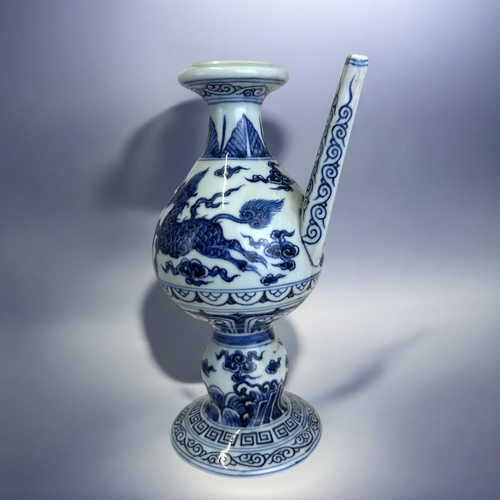 21 - A Chinese porcelain Ming type Ewer.Xuande reign marks.Globular body with waisted neck, painted Kylin... 