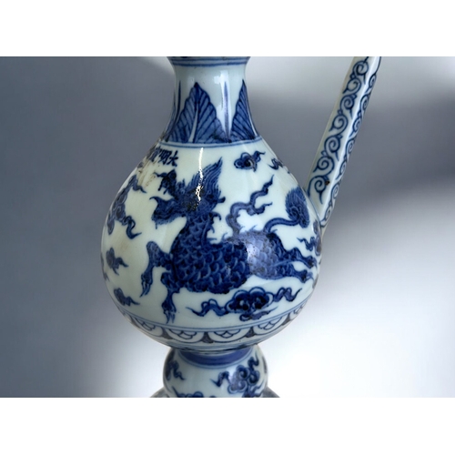 21 - A Chinese porcelain Ming type Ewer.Xuande reign marks.Globular body with waisted neck, painted Kylin... 