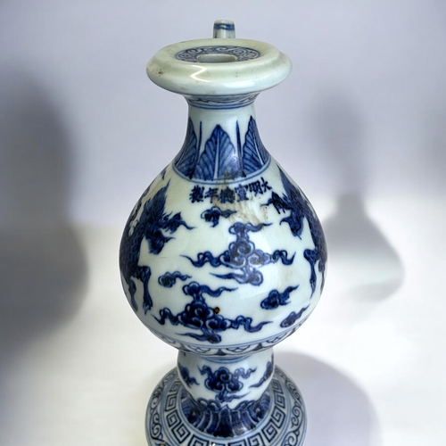 21 - A Chinese porcelain Ming type Ewer.Xuande reign marks.Globular body with waisted neck, painted Kylin... 