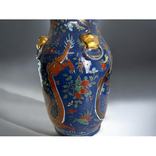 16 - A large pair of Chinese porcelain vases.Qing dynasty, 19th century.Blue ground, hand painted with Po... 