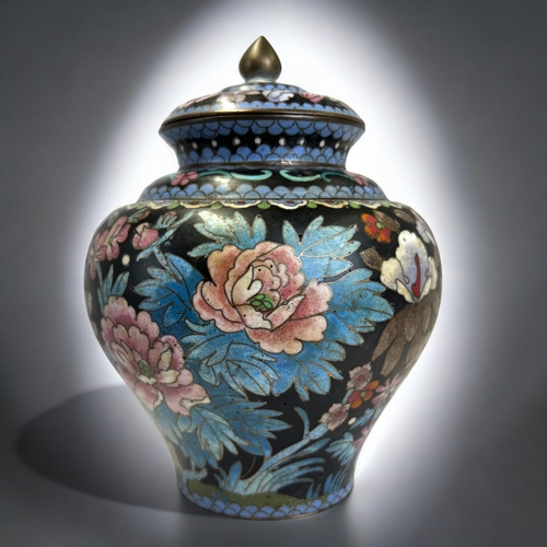 9 - A Chinese Cloisonné lidded jar.Qing dynasty.Squat form, intricately decorated with polychrome... 