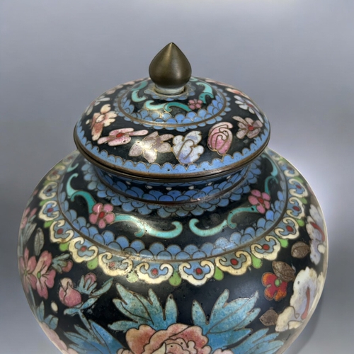 9 - A Chinese Cloisonné lidded jar.Qing dynasty.Squat form, intricately decorated with polychrome... 