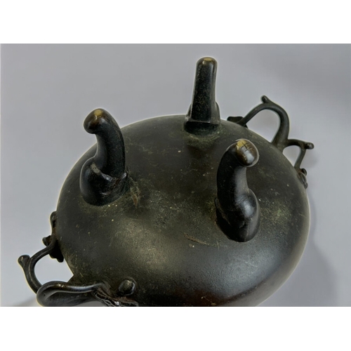 13 - A Japanese bronze tripod censer.Meiji period, 19th century.Raised on three feet, with Cherry blossom... 