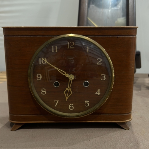 278 - Mid-Century Modern mechanical clock with brass and wood casing. Features classic Roman numeral dial ... 