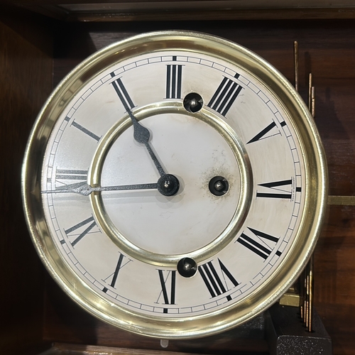 278 - Mid-Century Modern mechanical clock with brass and wood casing. Features classic Roman numeral dial ... 