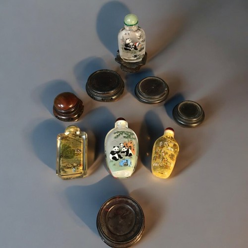 103 - Chinese Snuff Bottles x 4 all 20th Century and internally Painted. 2 have Giant Panda Decoration, 2 ... 