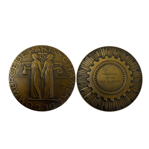 477 - A collection of five bronze medals.Including Paris Chamber of commerce - Dia 75mm.A 1935 German Army... 