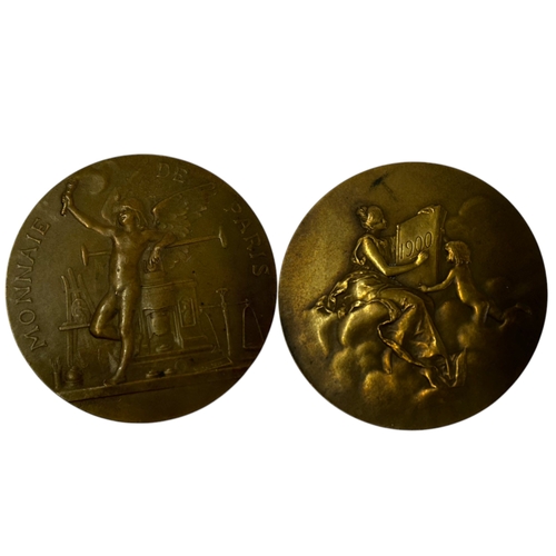 477 - A collection of five bronze medals.Including Paris Chamber of commerce - Dia 75mm.A 1935 German Army... 