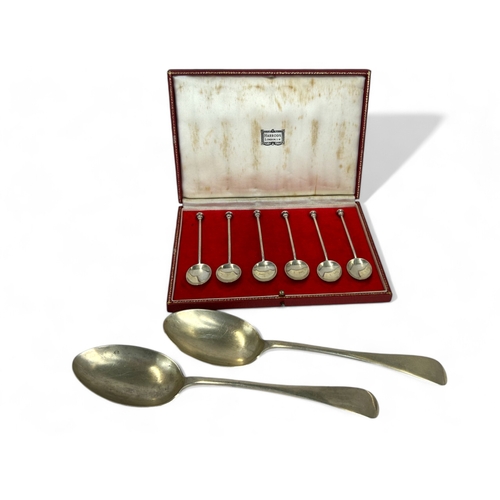 557 - A boxed set of Harrods Solid Hallmarked Silver Teaspoons. Together with Two Large John Round & S... 