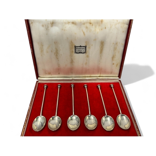 557 - A boxed set of Harrods Solid Hallmarked Silver Teaspoons. Together with Two Large John Round & S... 