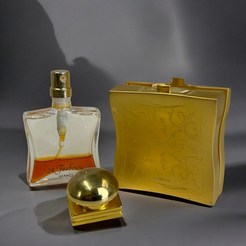 628 - A Hermes 24, Faubourg perfume holder.Together with an embroidered and engraved gilt metal clutch pur... 