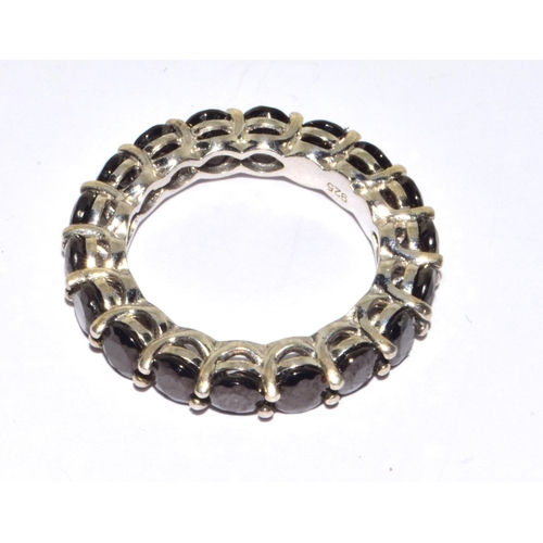 202 - 925 silver full eternity ring set with dark garnet stones size P