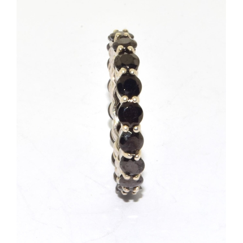 202 - 925 silver full eternity ring set with dark garnet stones size P