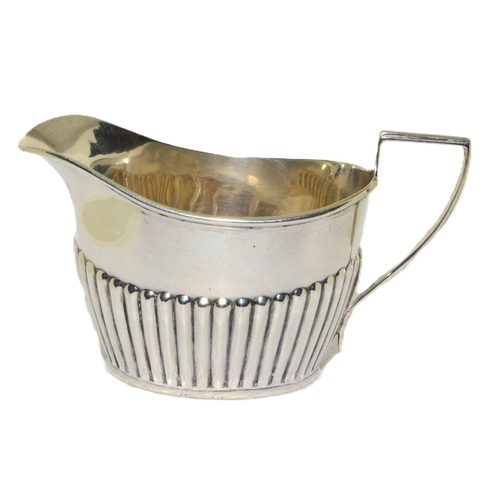 249 - Silver full hallmarked fluted bottom cream jug 65g 6x11x5cm 