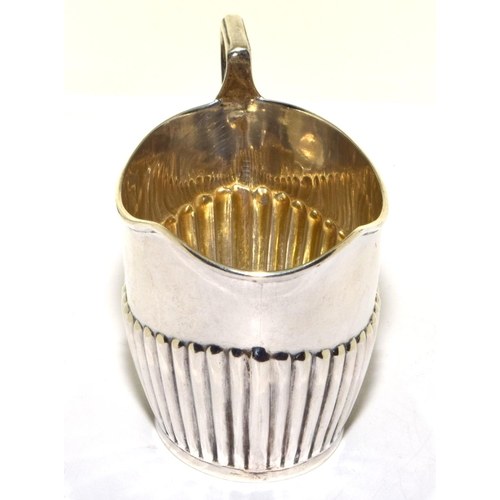 249 - Silver full hallmarked fluted bottom cream jug 65g 6x11x5cm 