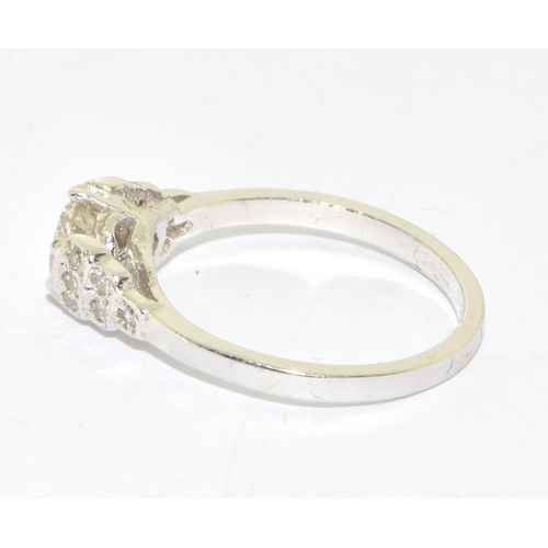 156 - 18ct white gold Diamond set ring the central stone flanked by graduated diamond shoulders size M