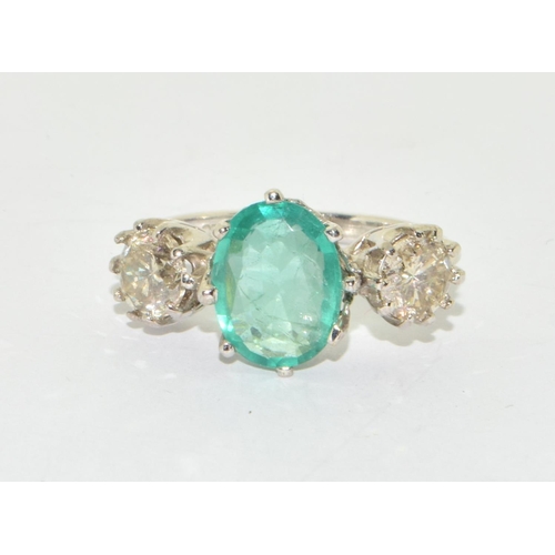 321 - Substantial 18ct white gold Emerald and Diamond  three stone ring  of approx 5.5cts size O