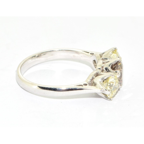 341 - Unusual 18ct three stone diamond ring with the centre stone being cognac and total of approx 2cts si... 