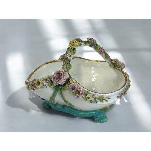 298 - A 19th century John Bevington porcelain basket.Hand painted encrusted flowers. 16 x 22cm