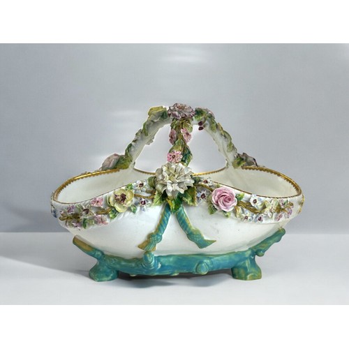 298 - A 19th century John Bevington porcelain basket.Hand painted encrusted flowers. 16 x 22cm