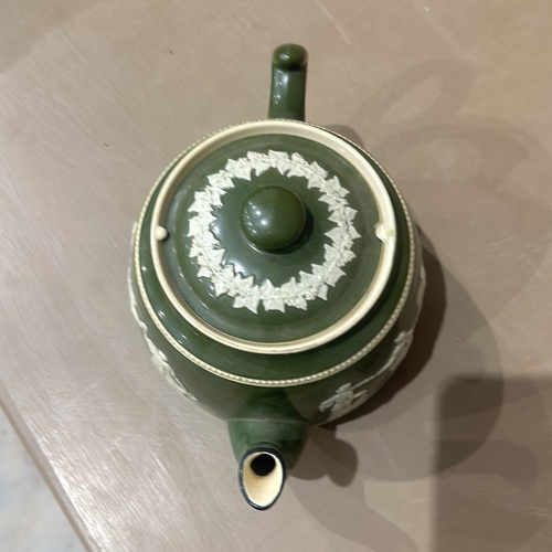 201 - Antique Green Jasperware carltonware teapot and jug set, featuring classical relief design. Marked 