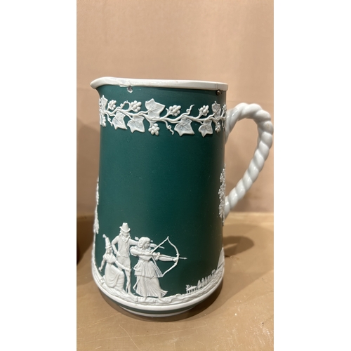 202 - Dudson Brothers stoneware jug, featuring green and white relief with archery scene, twisted handle. ... 