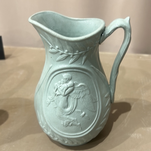 203 - Antique Wedgwood Style Jasperware jug features classical figures in blue with white relief. It is ma... 